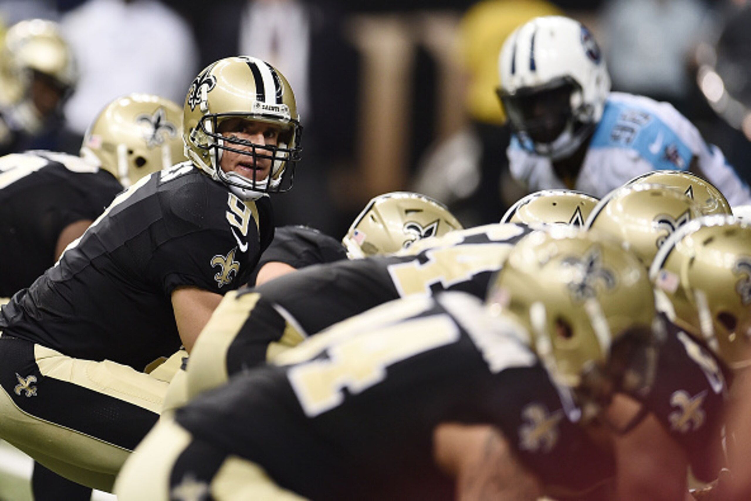 NEW ORLEANS, LA - NOVEMBER 08:  Drew Brees #9 of the New Orleans Saints anticipates a play during a game against the Tennessee Titans at the Mercedes-Benz Superdome on November 8, 2015 in New Orleans, Louisiana.  The Titans won the game in overtime 34-28.