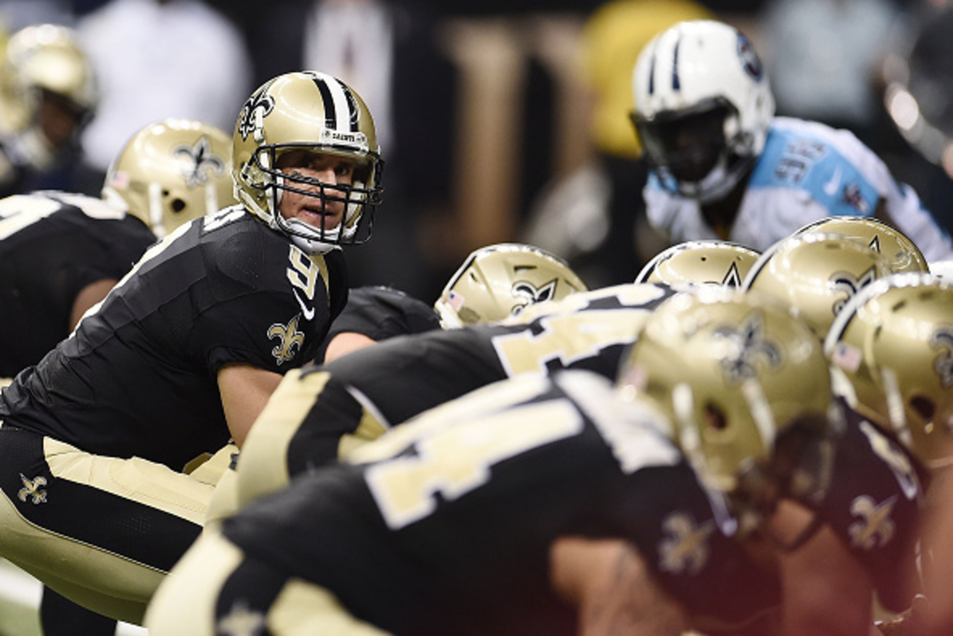 NEW ORLEANS, LA - NOVEMBER 08:  Drew Brees #9 of the New Orleans Saints anticipates a play during a game against the Tennessee Titans at the Mercedes-Benz Superdome on November 8, 2015 in New Orleans, Louisiana.  The Titans won the game in overtime 34-28.