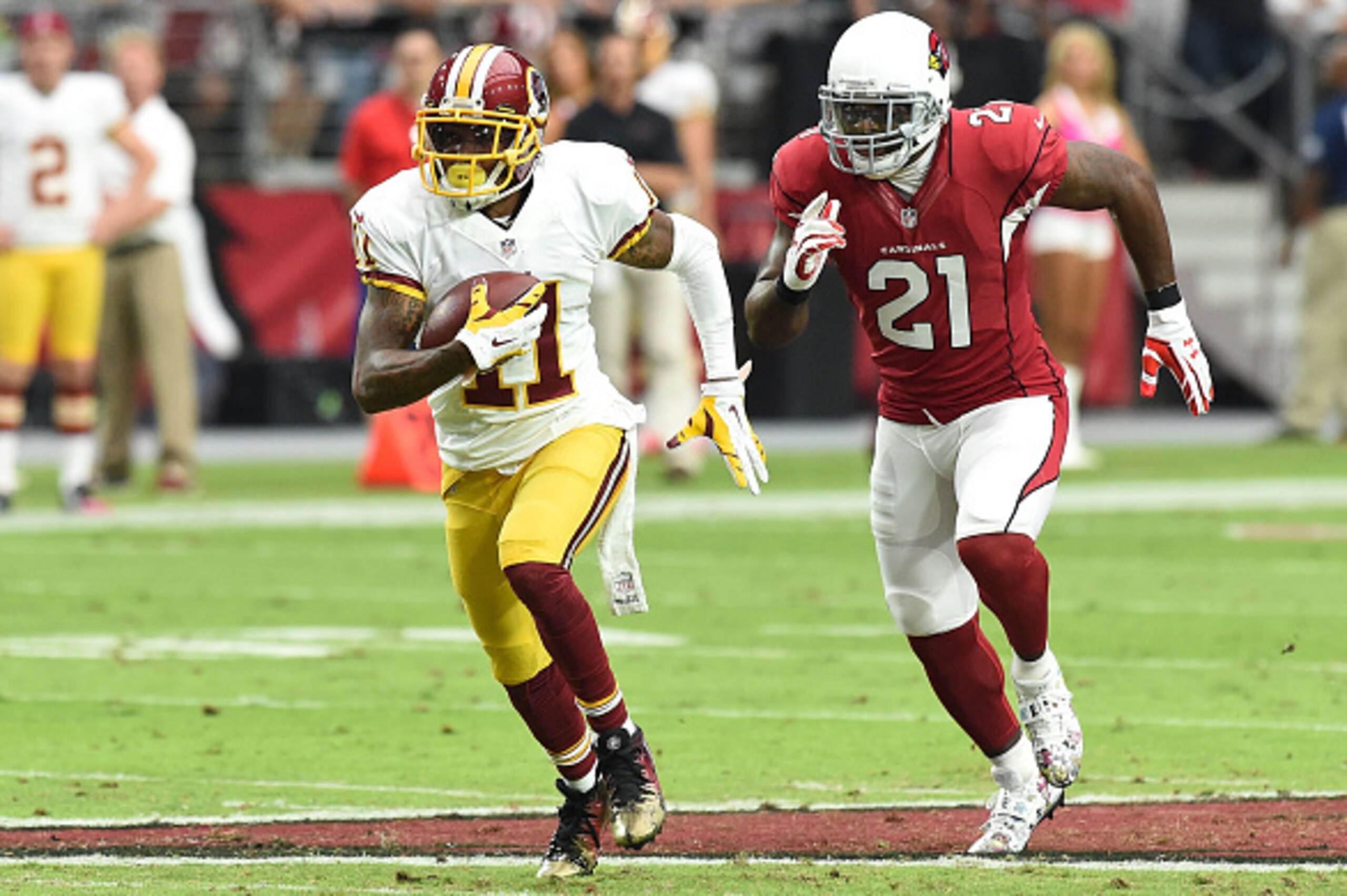 GLENDALE, AZ - OCTOBER 12: Wide receiver DeSean Jackson #11 of the Washington Redskins breaks away from cornerback Patrick Peterson #21 of the Arizona Cardinals for a touchdown during the second quarter of the NFL game at University of Phoenix Stadium on 