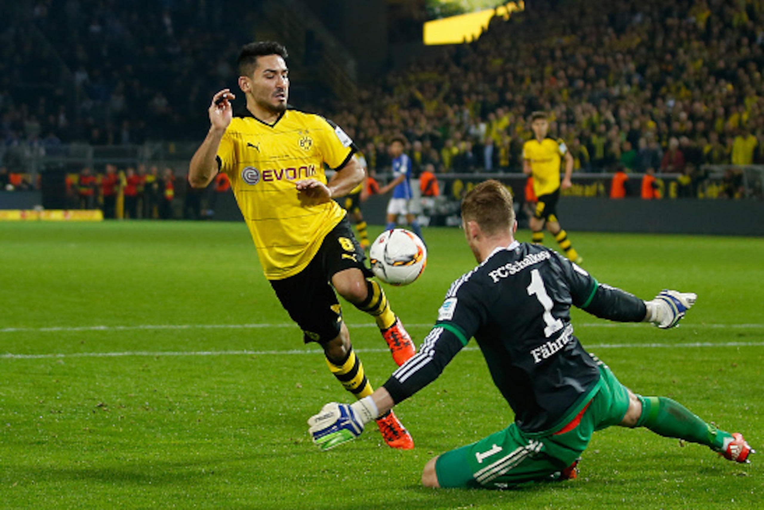 DORTMUND, GERMANY - NOVEMBER 08: Goalkeeper Ralf Faehrmann (R) of Schalke saves a ball of Ilkay Guendogan of Dortmund during the Bundesliga match between Borussia Dortmund and FC Schalke 04 at Signal Iduna Park on November 8, 2015 in Dortmund, Germany.  (