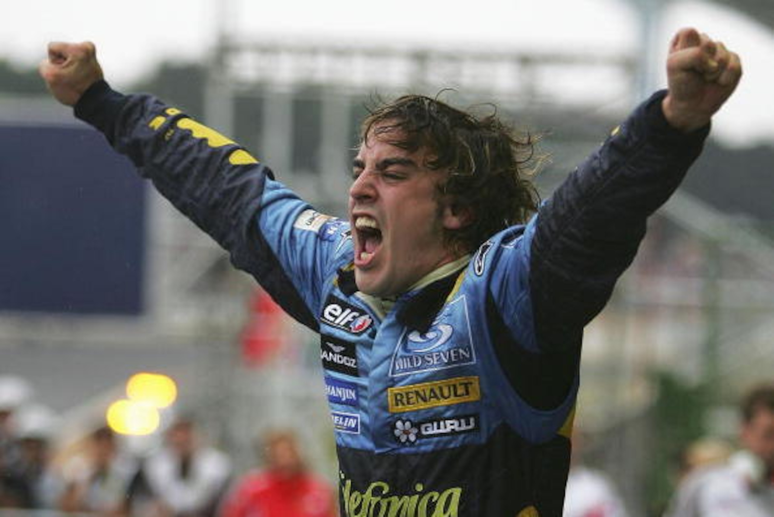 SAO PAULO, BRAZIL - SEPTEMBER 25:  Fernando Alonso of Spain and Renault celebrates winning the World Championship after finishing third in the Brazilian F1 Grand Prix at the Autodromo Interlagos on September 25, 2005 in Sao Paulo, Brazil.  (Photo by Clive