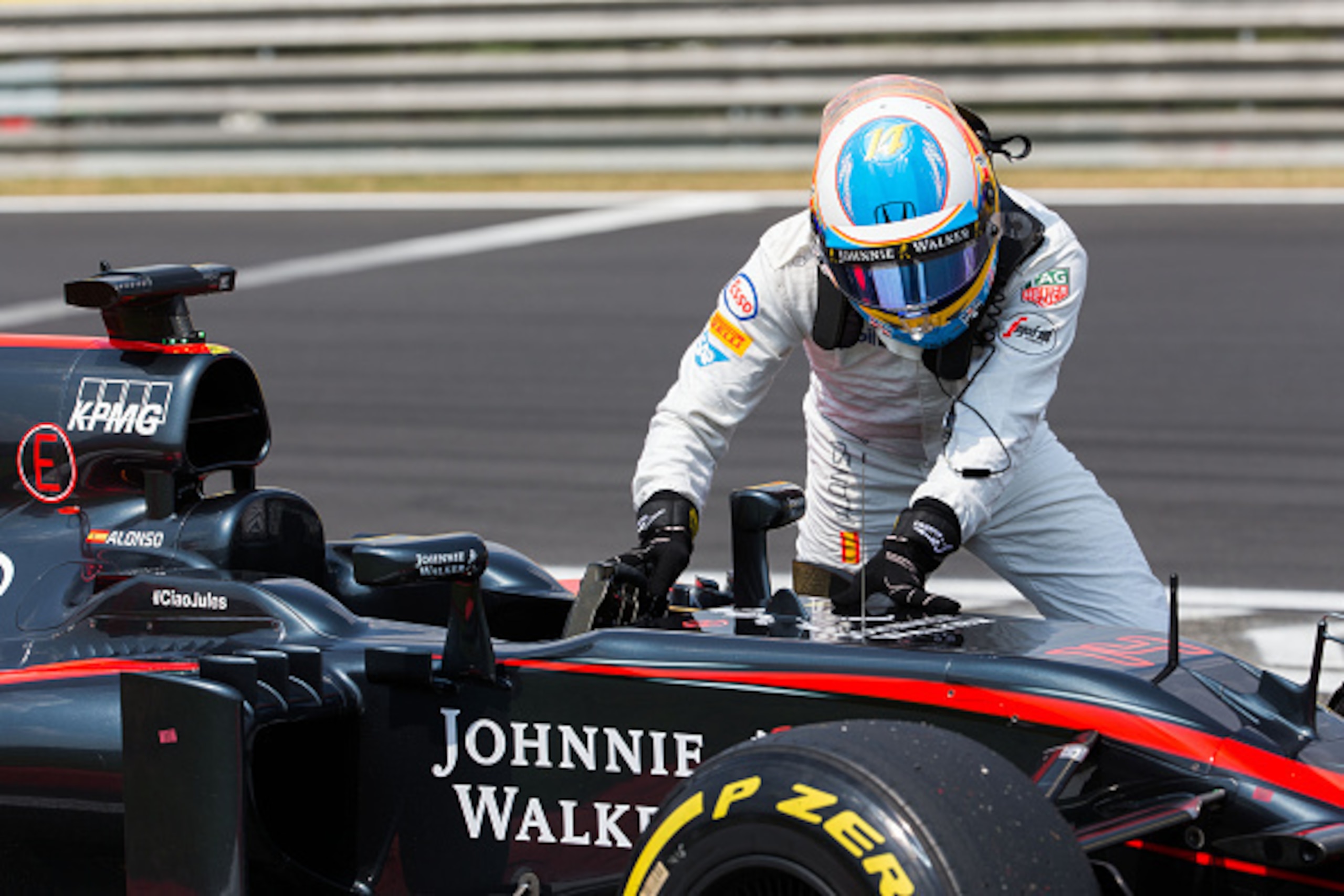 BUDAPEST, HUNGARY - JULY 25:  Fernando Alonso of McLaren and Spain breaks down during qualifying for the Formula One Grand Prix of Hungary at Hungaroring on July 25, 2015 in Budapest, Hungary.  (Photo by Peter J Fox/Getty Images)