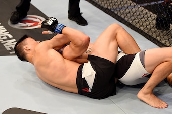 MELBOURNE, AUSTRALIA - NOVEMBER 15:  Ben Nguyen puts Ryan Benoit in a rear naked choke to submit him and win in the first round of their flyweight bout during the UFC 193 event at Etihad Stadium on November 15, 2015 in Melbourne, Australia.  (Photo by Jos