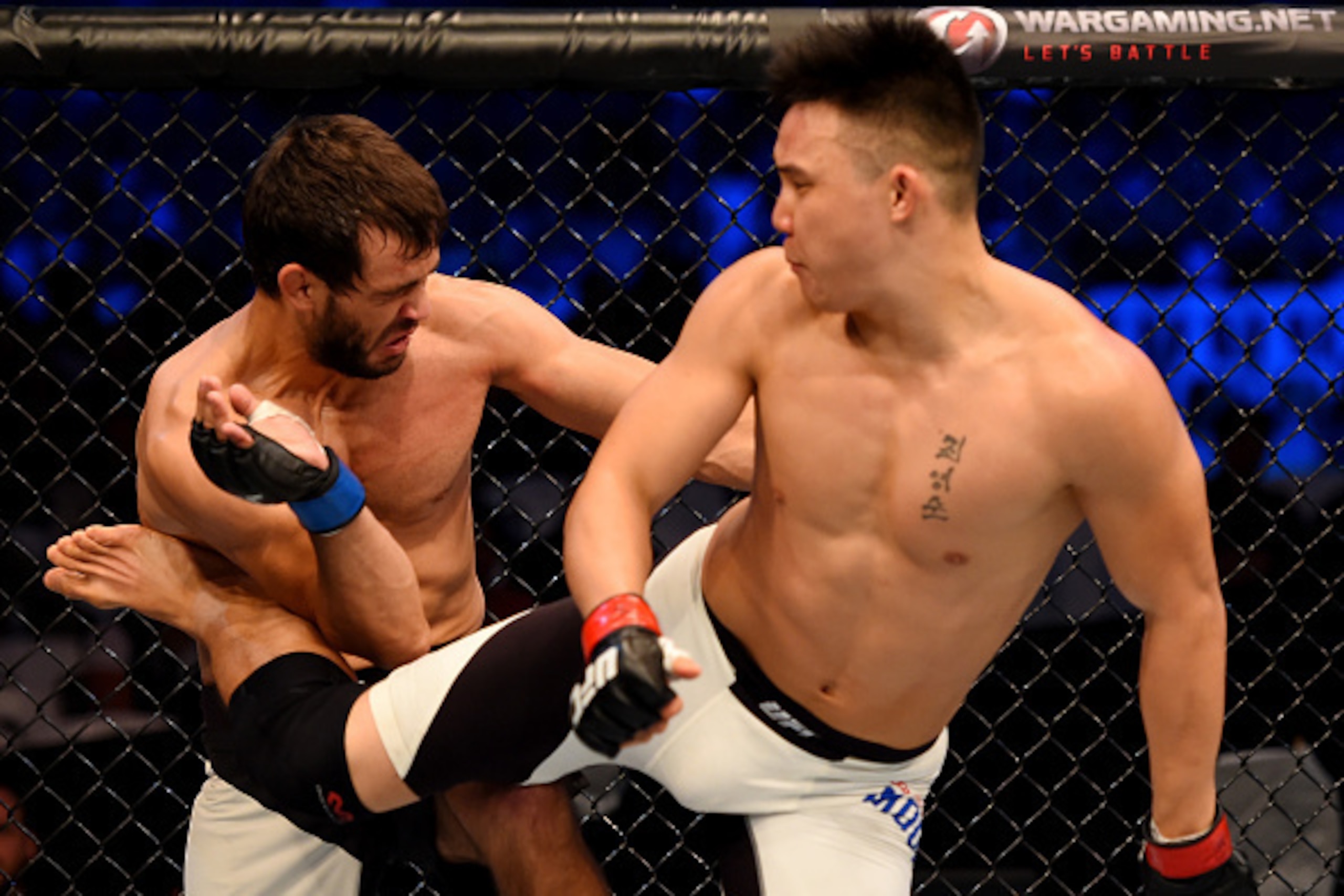 MELBOURNE, AUSTRALIA - NOVEMBER 15:  James Moontasri (R) performs a spinning back kick to the abdomen of Anton Zafir (L) in round one of their welterweight bout during the UFC 193 event at Etihad Stadium on November 15, 2015 in Melbourne, Australia.  (Pho