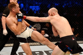 MELBOURNE, AUSTRALIA - NOVEMBER 15:  Richard Walsh (R) throws a left-handed punch against Steven Kennedy (L) in round two of their welterweight bout during the UFC 193 event at Etihad Stadium on November 15, 2015 in Melbourne, Australia.  (Photo by Josh H