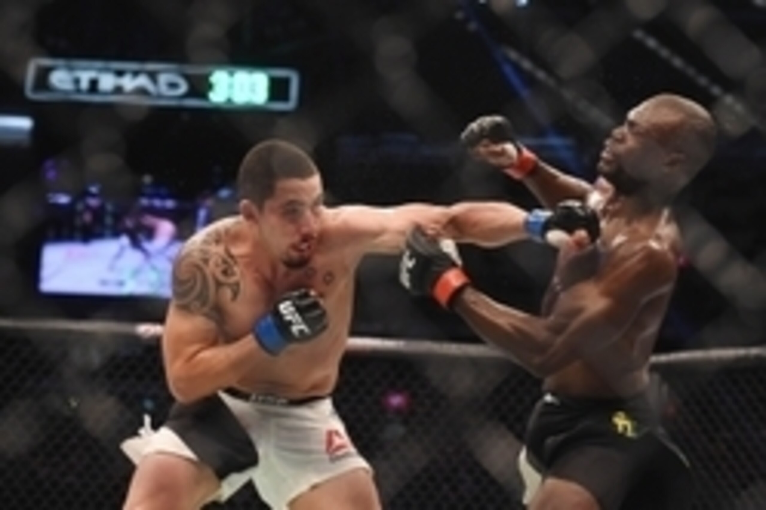 Nov 15, 2015; Melbourne, Australia; Uriah Hall (red gloves) competes against Robert Whittaker (blue gloves) during UFC 193 at Etihad Stadium. Mandatory Credit: Matt Roberts-USA TODAY Sports