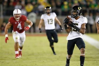 Oregon RB Taj Griffin (right)