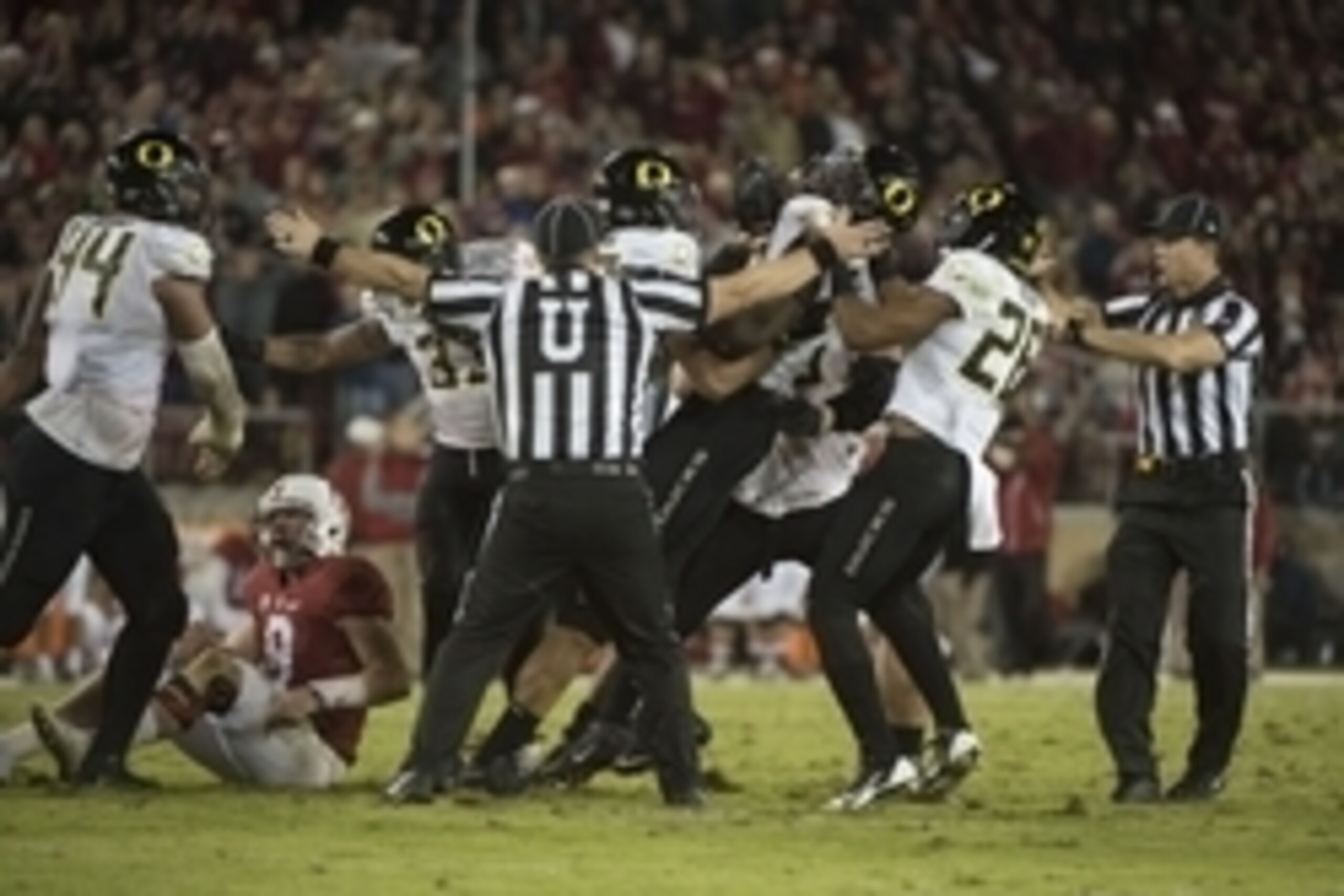 November 14, 2015; Stanford, CA, USA; Oregon Ducks linebacker Torrodney Prevot (86, second from right) is congratulated for recovering a fumble by Stanford Cardinal quarterback Kevin Hogan (8) during the fourth quarter at Stanford Stadium. The Ducks defea