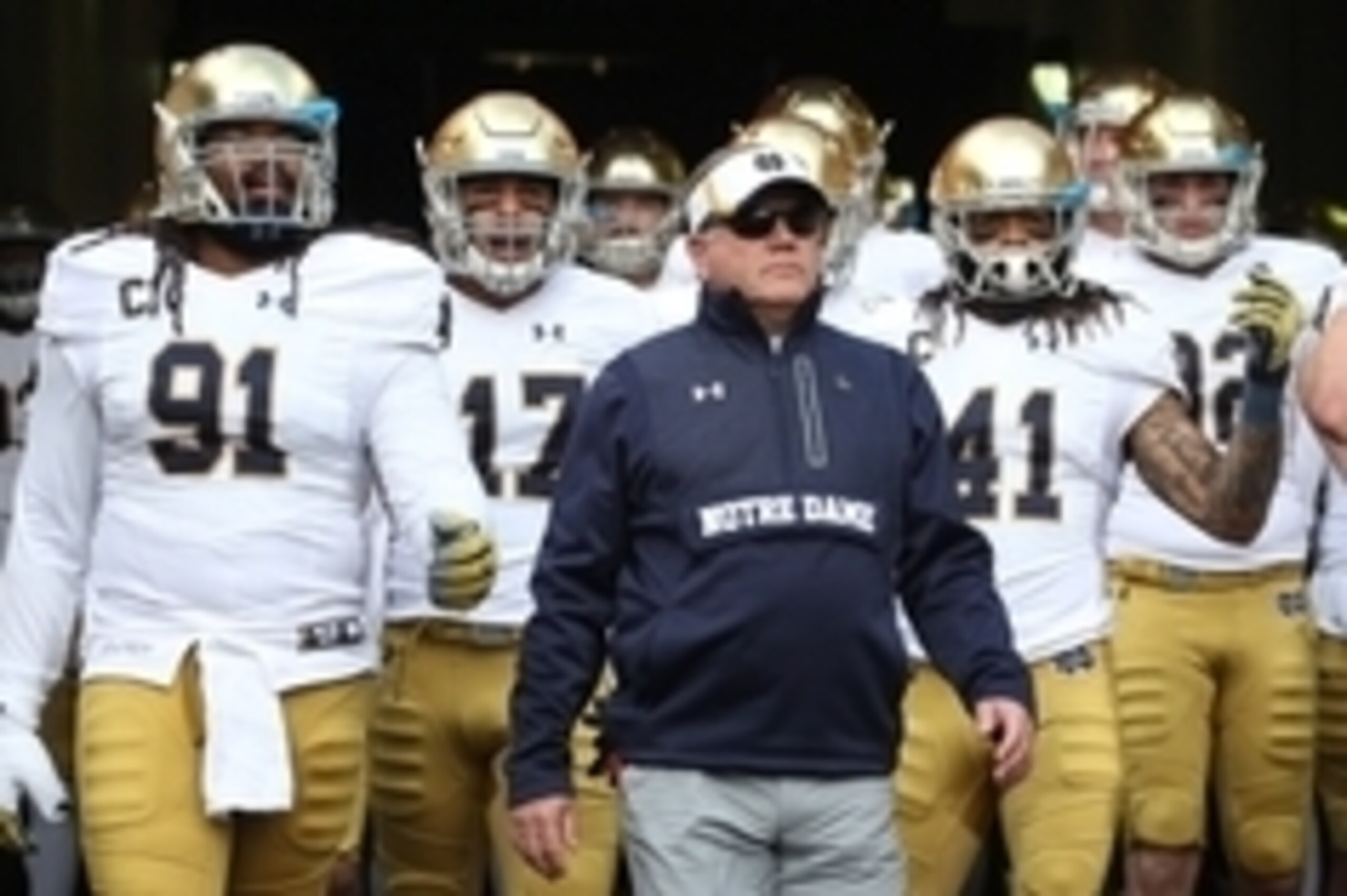 Nov 7, 2015; Pittsburgh, PA, USA; Notre Dame head coach Brian Kelly (middle) leads the Fighting Irish onto the field to play the Pittsburgh Panthers at Heinz Field. Mandatory Credit: Charles LeClaire-USA TODAY Sports
