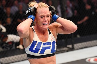 MELBOURNE, AUSTRALIA - NOVEMBER 15:  Holly Holm celebrates her second round KO (headkick and punches) over Ronda Rousey (not pictured) in their UFC women's bantamweight championship bout during the UFC 193 event at Etihad Stadium on November 15, 2015 in M