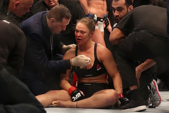 MELBOURNE, AUSTRALIA - NOVEMBER 15:  Ronda Rousey of the United States receives medical treatment after being defeated by Holly Holm of the United States in their UFC women's bantamweight championship bout during the UFC 193 event at Etihad Stadium on Nov
