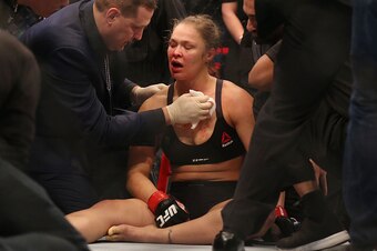 MELBOURNE, AUSTRALIA - NOVEMBER 15:  Ronda Rousey of the United States receives medical treatment after being defeated by Holly Holm of the United States in their UFC women's bantamweight championship bout during the UFC 193 event at Etihad Stadium on Nov