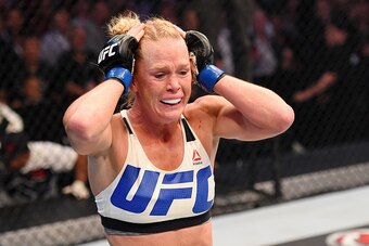 MELBOURNE, AUSTRALIA - NOVEMBER 15:  Holly Holm celebrates her second round KO (headkick and punches) over Ronda Rousey (not pictured) in their UFC women's bantamweight championship bout during the UFC 193 event at Etihad Stadium on November 15, 2015 in M