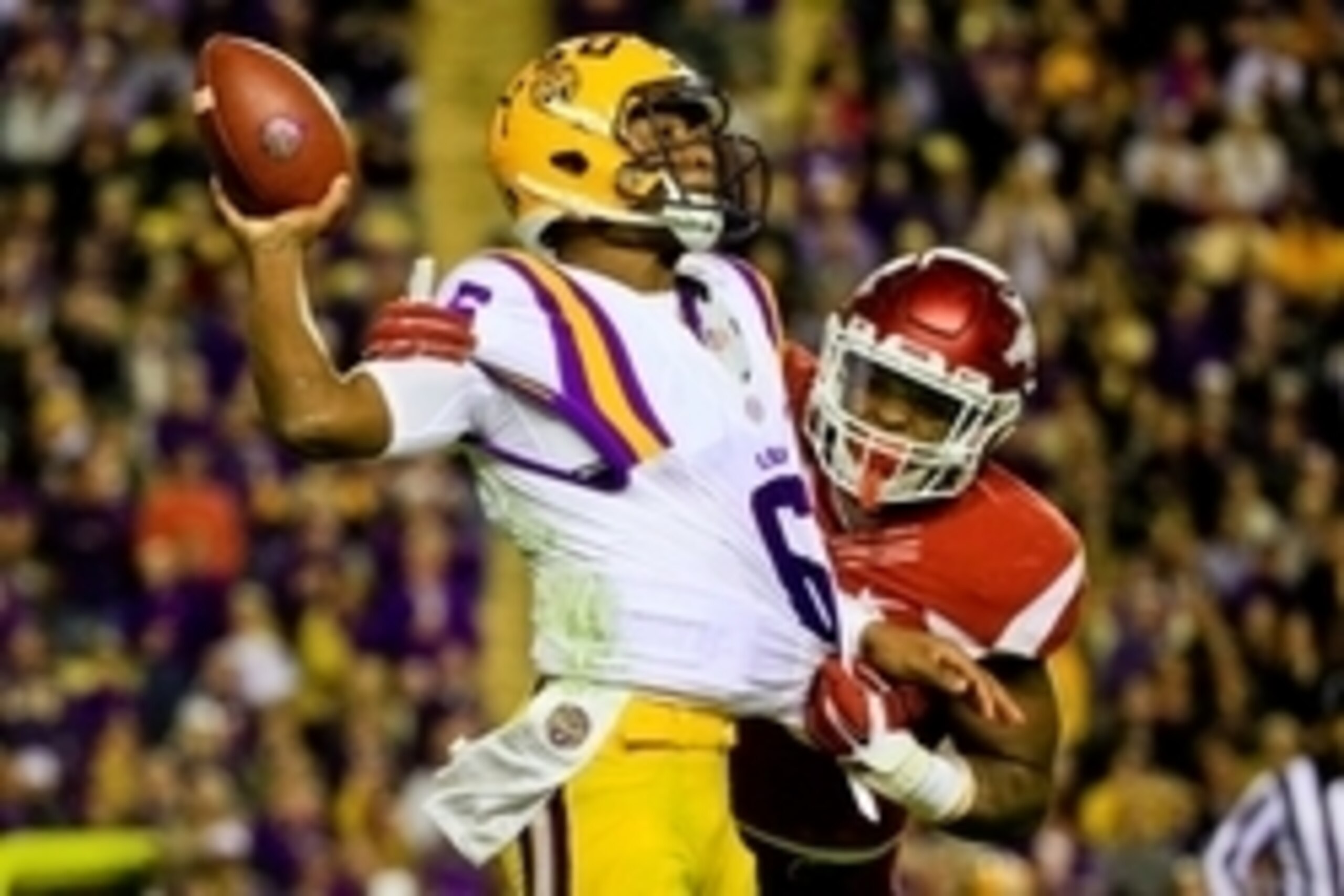 Nov 14, 2015; Baton Rouge, LA, USA; Arkansas Razorbacks linebacker Dre Greenlaw (23) forces LSU Tigers quarterback Brandon Harris (6) to fumble  during the second quarter of a game at Tiger Stadium. Mandatory Credit: Derick E. Hingle-USA TODAY Sports