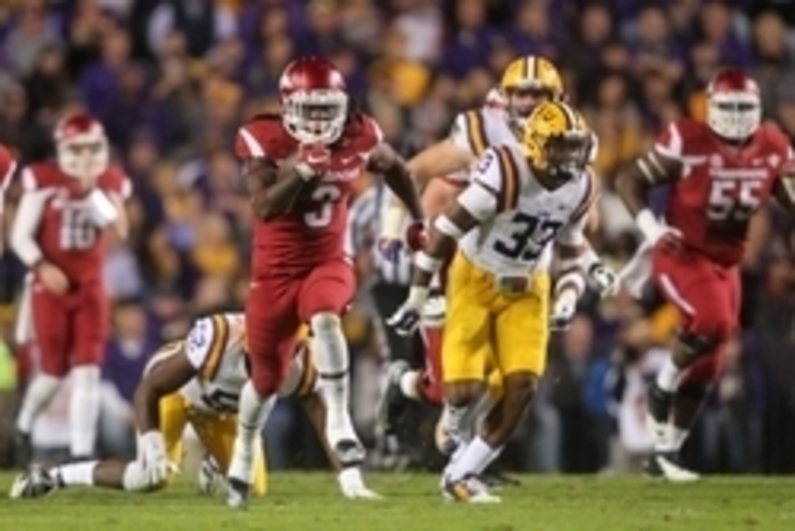 Nov 14, 2015; Baton Rouge, LA, USA; Arkansas Razorbacks running back Alex Collins (3) carries the ball to score a touchdown against the LSU Tigers in the first half at Tiger Stadium. Mandatory Credit: Crystal LoGiudice-USA TODAY Sports