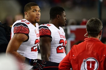 TUCSON, AZ - NOVEMBER 14: Running back Devontae Booker #23 of the Utah Utes watches on from the sidelines in the first half of the game against Arizona Wildcats at Arizona Stadium on November 14, 2015 in Tucson, Arizona.  (Photo by Jennifer Stewart/Getty 