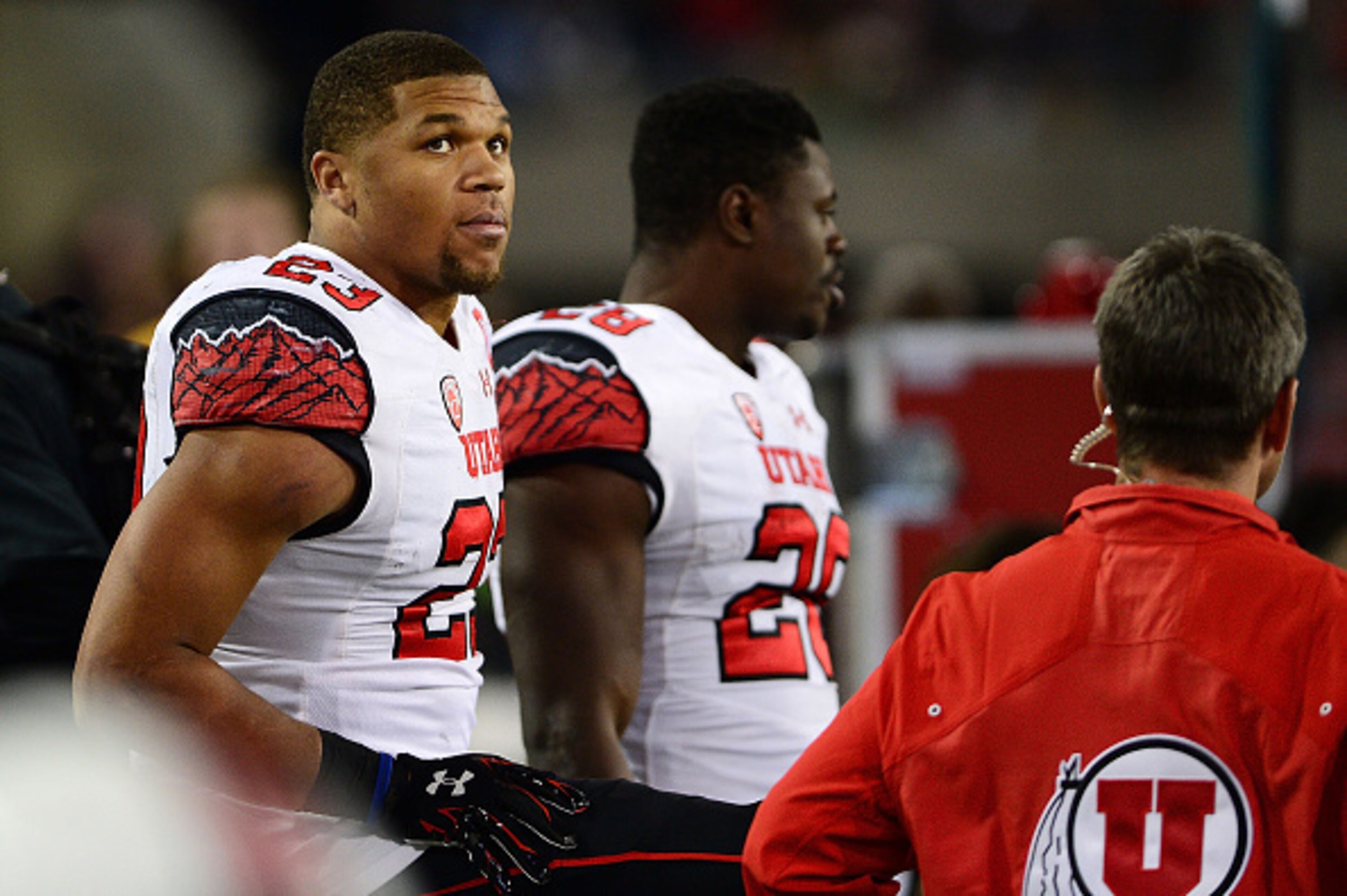 TUCSON, AZ - NOVEMBER 14: Running back Devontae Booker #23 of the Utah Utes watches on from the sidelines in the first half of the game against Arizona Wildcats at Arizona Stadium on November 14, 2015 in Tucson, Arizona.  (Photo by Jennifer Stewart/Getty 