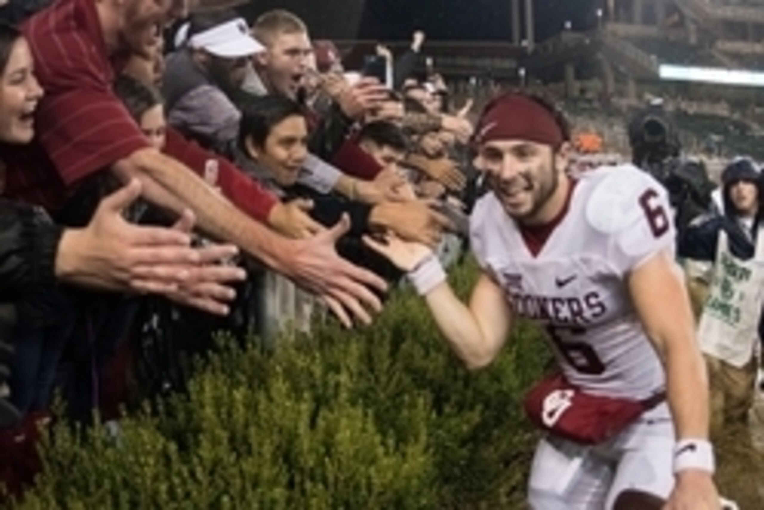 Nov 14, 2015; Waco, TX, USA; Oklahoma Sooners quarterback Baker Mayfield (6) celebrates with the Sooner fans after the win over the Baylor Bears at McLane Stadium. The Sooners defeat the Bears 44-34. Mandatory Credit: Jerome Miron-USA TODAY Sports