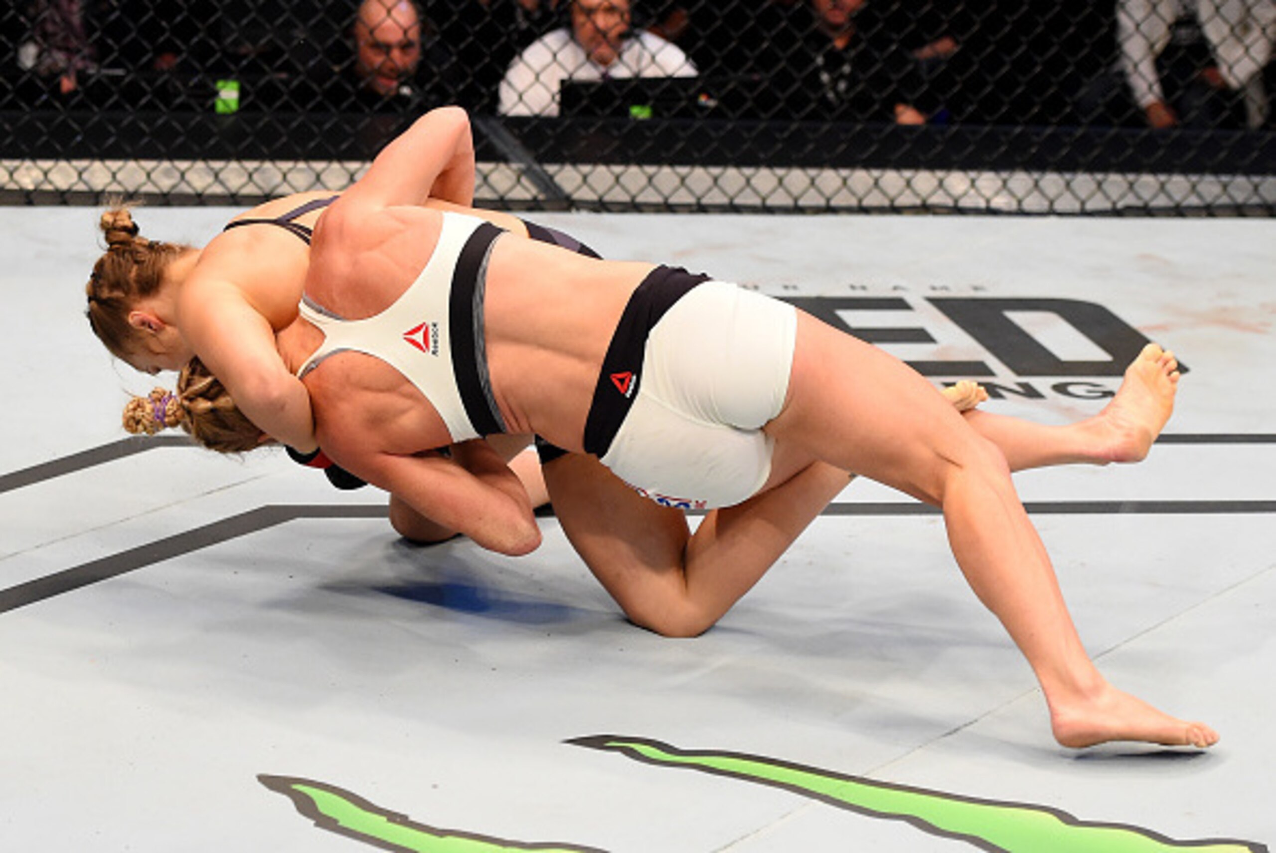 MELBOURNE, AUSTRALIA - NOVEMBER 15:  Ronda Rousey takes down Holly Holm in their UFC women's bantamweight championship bout during the UFC 193 event at Etihad Stadium on November 15, 2015 in Melbourne, Australia.  (Photo by Josh Hedges/Zuffa LLC/Zuffa LLC