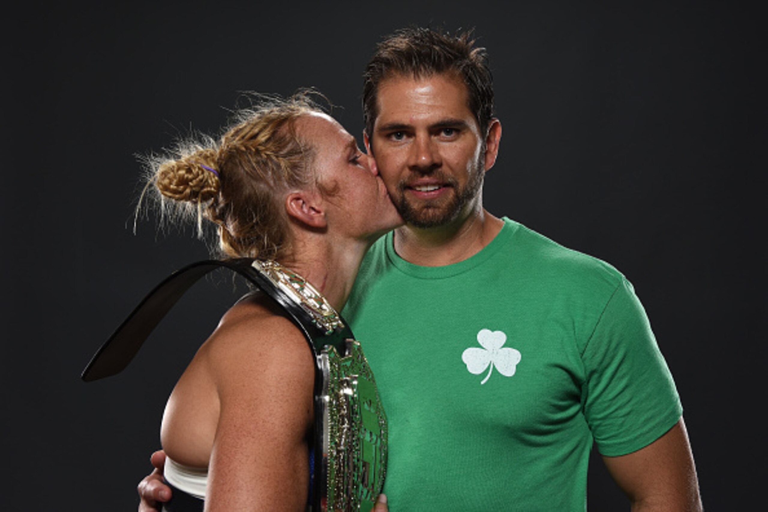 MELBOURNE, AUSTRALIA - NOVEMBER 15:  UFC women's bantamweight champion Holly Holm (L) poses with her husband Jeff Kirkpatrick backstage for a post-fight portrait after the UFC 193 event at Etihad Stadium on November 15, 2015 in Melbourne, Australia. Holly