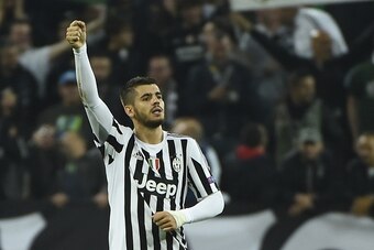 Juventus' forward from Spain Alvaro Morata celebrates after scoring during the UEFA Champions League football match Juventus vs FC Sevilla on September 30 at the Juventus stadium in Turin.  AFP PHOTO / OLIVIER MORIN        (Photo credit should read OLIVIE