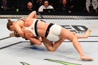 MELBOURNE, AUSTRALIA - NOVEMBER 15:  Ronda Rousey takes down Holly Holm in their UFC women's bantamweight championship bout during the UFC 193 event at Etihad Stadium on November 15, 2015 in Melbourne, Australia.  (Photo by Josh Hedges/Zuffa LLC/Zuffa LLC