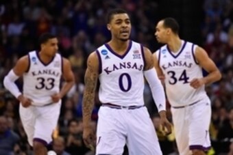 Mar 22, 2015; Omaha, NE, USA; Kansas Jayhawks guard Frank Mason III (0) reacts in the game against the Wichita State Shockers during the first half in the third round of the 2015 NCAA Tournament at CenturyLink Center. Mandatory Credit: Jasen Vinlove-USA T