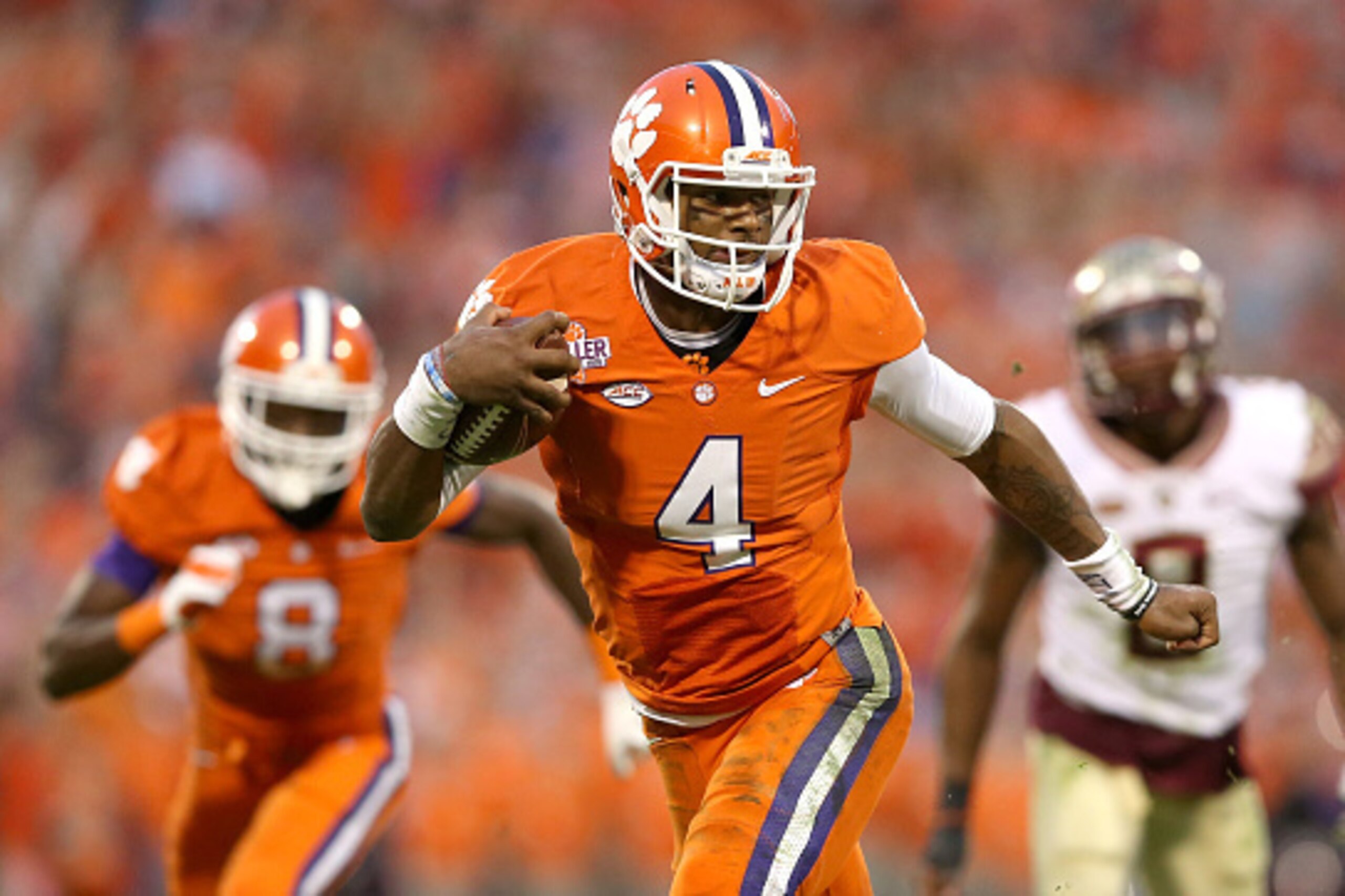 CLEMSON, SC - NOVEMBER 07:  Deshaun Watson #4 of the Clemson Tigers runs with the ball against the Florida State Seminoles during their game at Memorial Stadium on November 7, 2015 in Clemson, South Carolina.  (Photo by Streeter Lecka/Getty Images)