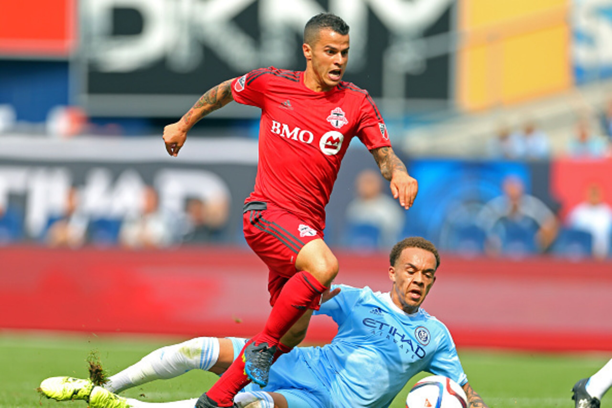 NEW YORK, NY - JULY 12: Sebastian Giovinco #10 of Toronto FC gets past New York City FC Shay Facey #24 during a soccer game at Yankee Stadium on July 12, 2015 in the Bronx borough of New York City. (Photo by Adam Hunger/Getty Images)
