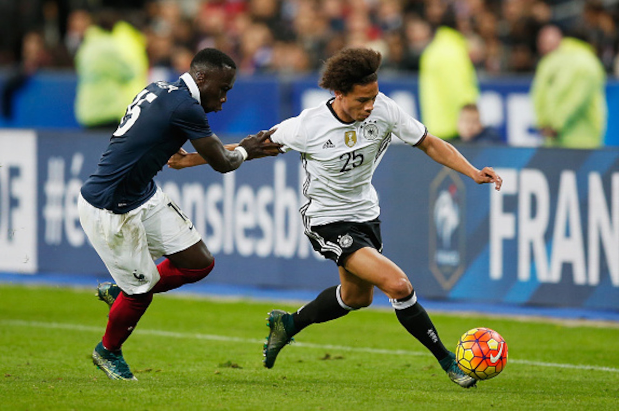 PARIS, FRANCE - NOVEMBER 13:  Bacary Sagna of France (L) challenges Leroy Sane of Germany during the International Friendly match between France and Germany at the Stade de France on November 13, 2015 in Paris, France.  (Photo by Boris Streubel/Getty Imag