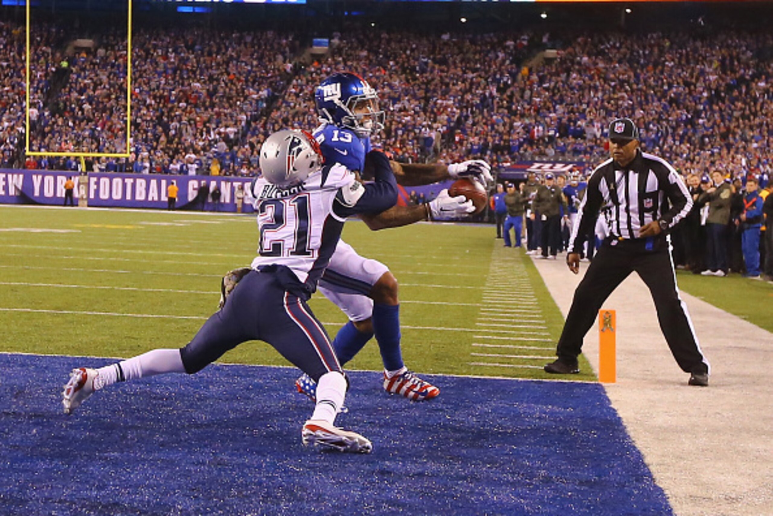 EAST RUTHERFORD, NJ - NOVEMBER 15:  Odell Beckham #13 of the New York Giants cannot hold onto the ball which is broken up in the end zone by  Malcolm Butler #21 of the New England Patriots in the fourth Quarter during their game at MetLife Stadium on Nove