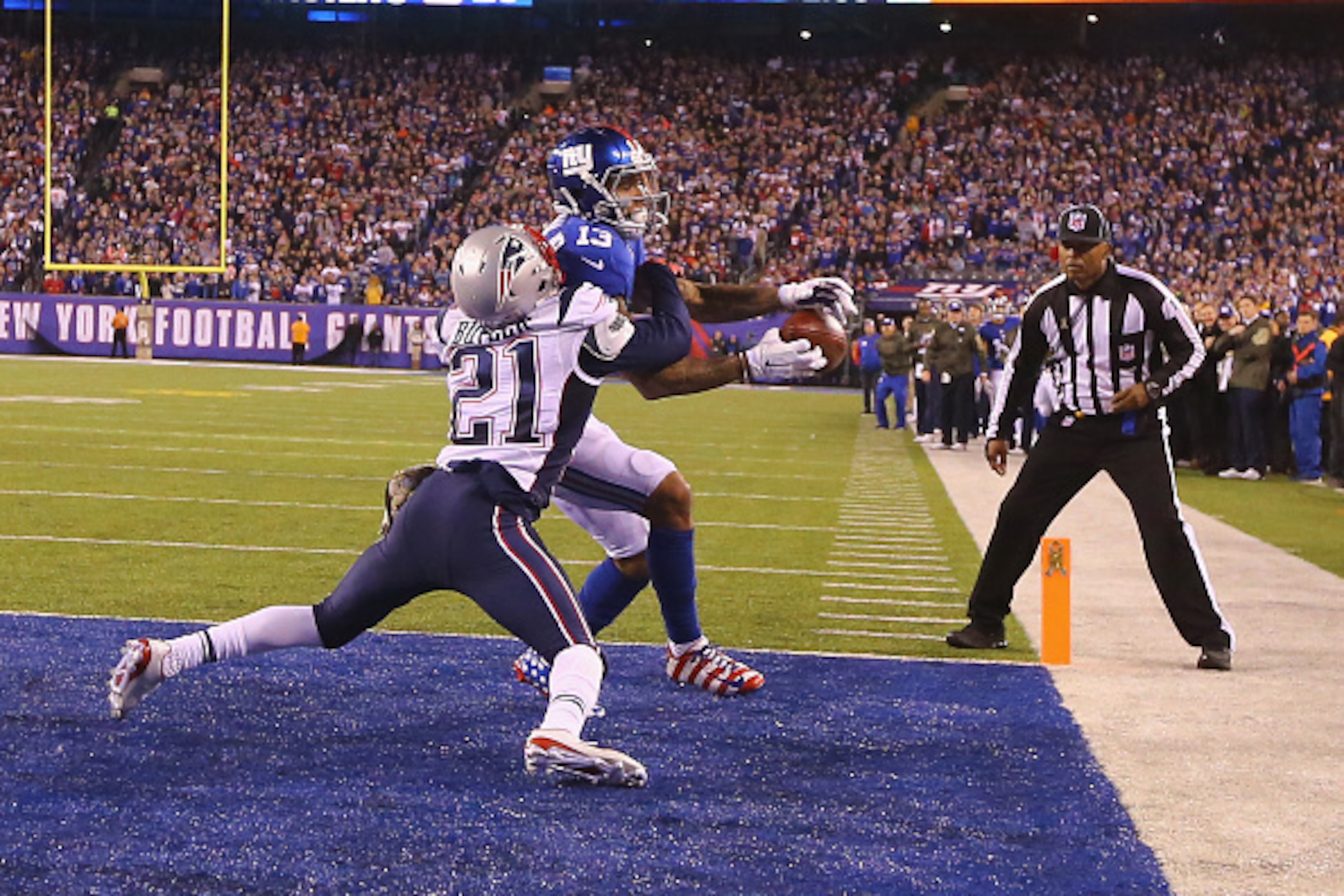 EAST RUTHERFORD, NJ - NOVEMBER 15:  Odell Beckham #13 of the New York Giants cannot hold onto the ball which is broken up in the end zone by  Malcolm Butler #21 of the New England Patriots in the fourth Quarter during their game at MetLife Stadium on Nove