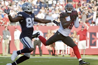 Bradley McDougald intercepts a pass from Matt Cassel intended for Dez Bryant.