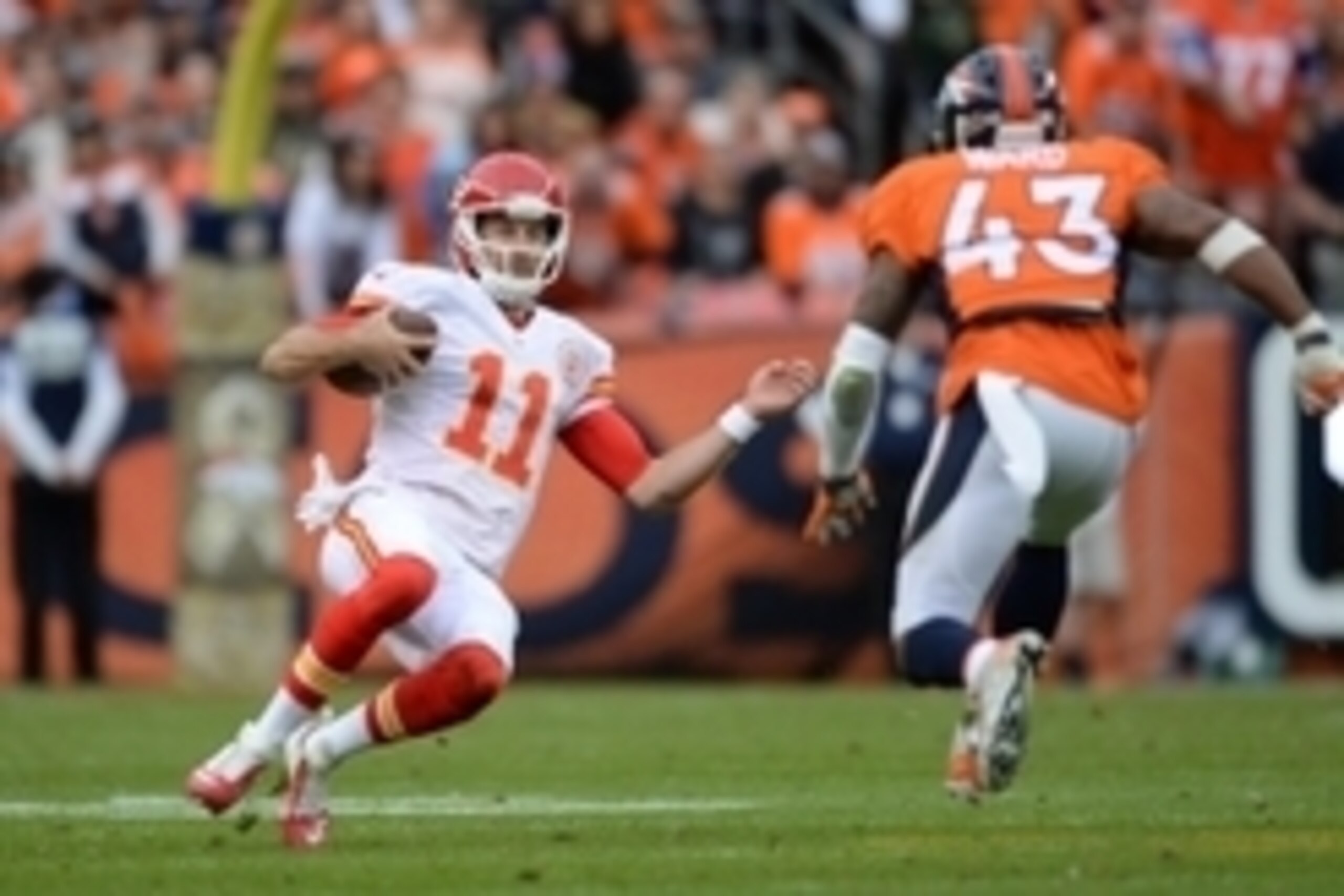 Nov 15, 2015; Denver, CO, USA; Kansas City Chiefs quarterback Alex Smith (11) slides as Denver Broncos strong safety T.J. Ward (43) closes in in the second quarter at Sports Authority Field at Mile High. Mandatory Credit: Ron Chenoy-USA TODAY Sports Nov 15, 2015; Denver, CO, USA; Kansas City Chiefs quarterback Alex Smith (11) slides as Denver Broncos strong safety T.J. Ward (43) closes in in the second quarter at Sports Authority Field at Mile High. Mandatory Credit: Ron Chenoy-USA TODAY Sports