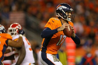 DENVER, CO - NOVEMBER 15:  Quarterback Brock Osweiler #17 of the Denver Broncos runs with the football during the third quarter against the Kansas City Chiefs at Sports Authority Field Field at Mile High on November 15, 2015 in Denver, Colorado. The Chief