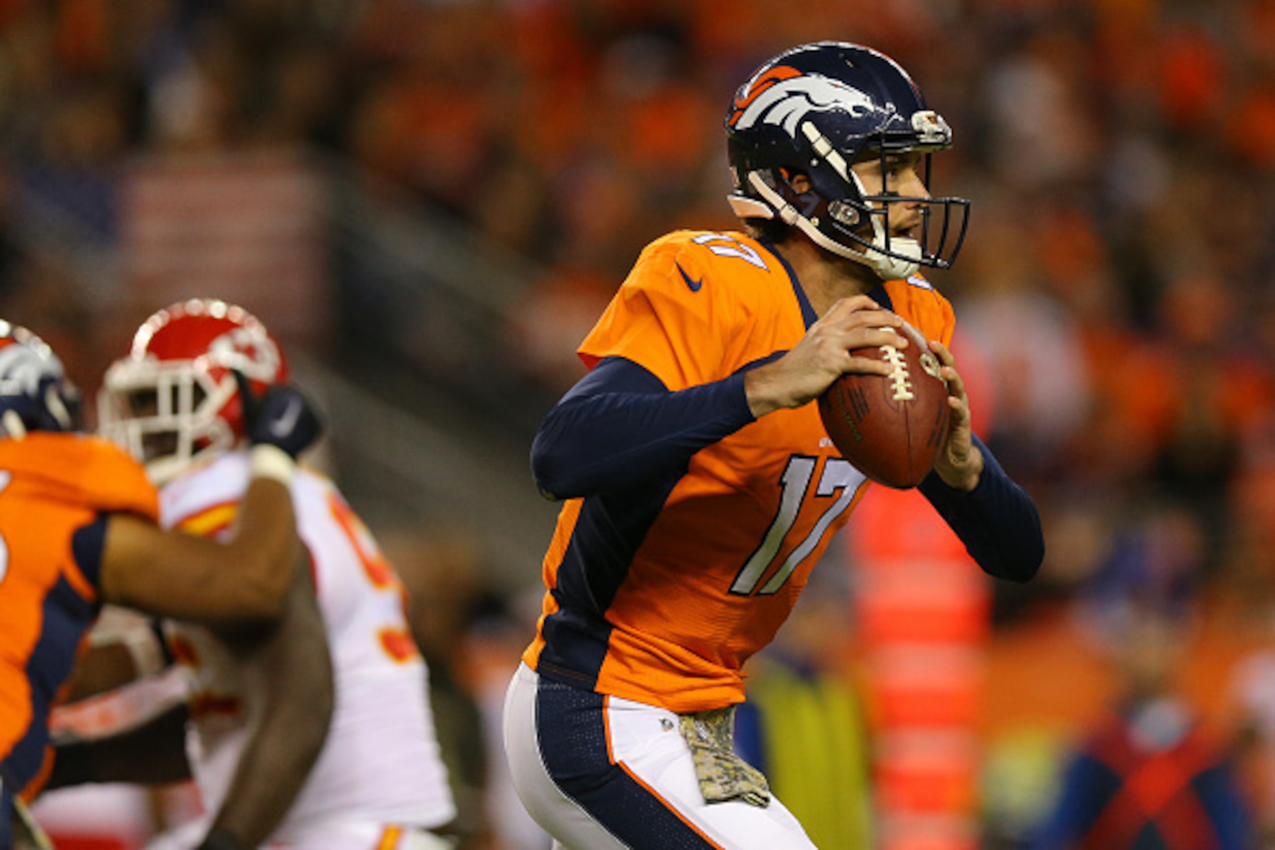 DENVER, CO - NOVEMBER 15:  Quarterback Brock Osweiler #17 of the Denver Broncos runs with the football during the third quarter against the Kansas City Chiefs at Sports Authority Field Field at Mile High on November 15, 2015 in Denver, Colorado. The Chief