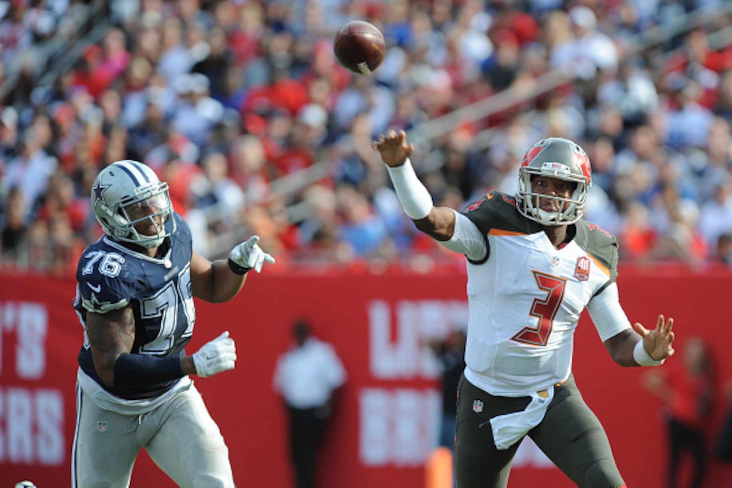 TAMPA, FL - NOVEMBER 15: Quarterback Jameis Winston #3 of the Tampa Bay Buccaneers scrambles away from defensive end Greg Hardy #76 of the Dallas Cowboys in the fourth quarter at Raymond James Stadium on November 15, 2015 in Tampa, Florida. (Photo by Clif
