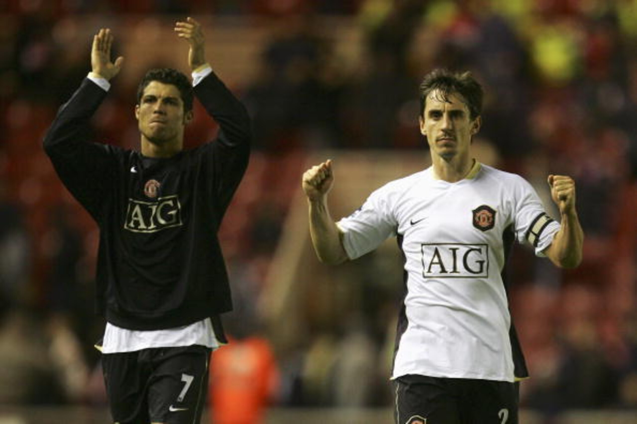 MIDDLESBROUGH, UNITED KINGDOM - DECEMBER 02: Cristiano Ronaldo (L) and Gary Neville of Manchester United celebrate their team's victory at the end of the Barclays Premiership match between Middlesbrough and Manchester United at the Riverside Stadium on D MIDDLESBROUGH, UNITED KINGDOM - DECEMBER 02: Cristiano Ronaldo (L) and Gary Neville of Manchester United celebrate their team's victory at the end of the Barclays Premiership match between Middlesbrough and Manchester United at the Riverside Stadium on D