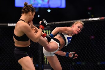 MELBOURNE, AUSTRALIA - NOVEMBER 15:  (R-L) Holly Holm kicks Ronda Rousey in their UFC women's bantamweight championship bout during the UFC 193 event at Etihad Stadium on November 15, 2015 in Melbourne, Australia. (Photo by Jeff Bottari/Zuffa LLC/Zuffa LL