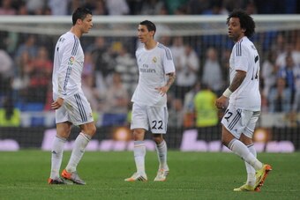MADRID, SPAIN - MAY 04:  Cristiano Ronaldo (L), Angel Di Maria and Marcelo of Real Madrid FC react during the La Liga match between Real Madrid CF and Valencia CF at Santiago Bernabeu stadium on May 4, 2014 in Madrid, Spain.  (Photo by Denis Doyle/Getty I