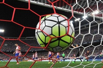 Barcelona's Argentinian forward Lionel Messi (unseen) scores during the Spanish league football match Club Atletico de Madrid vs FC Barcelona at the Vicente Calderon stadium in Madrid on September 12, 2015.   AFP PHOTO/ GERARD JULIEN        (Photo credit 