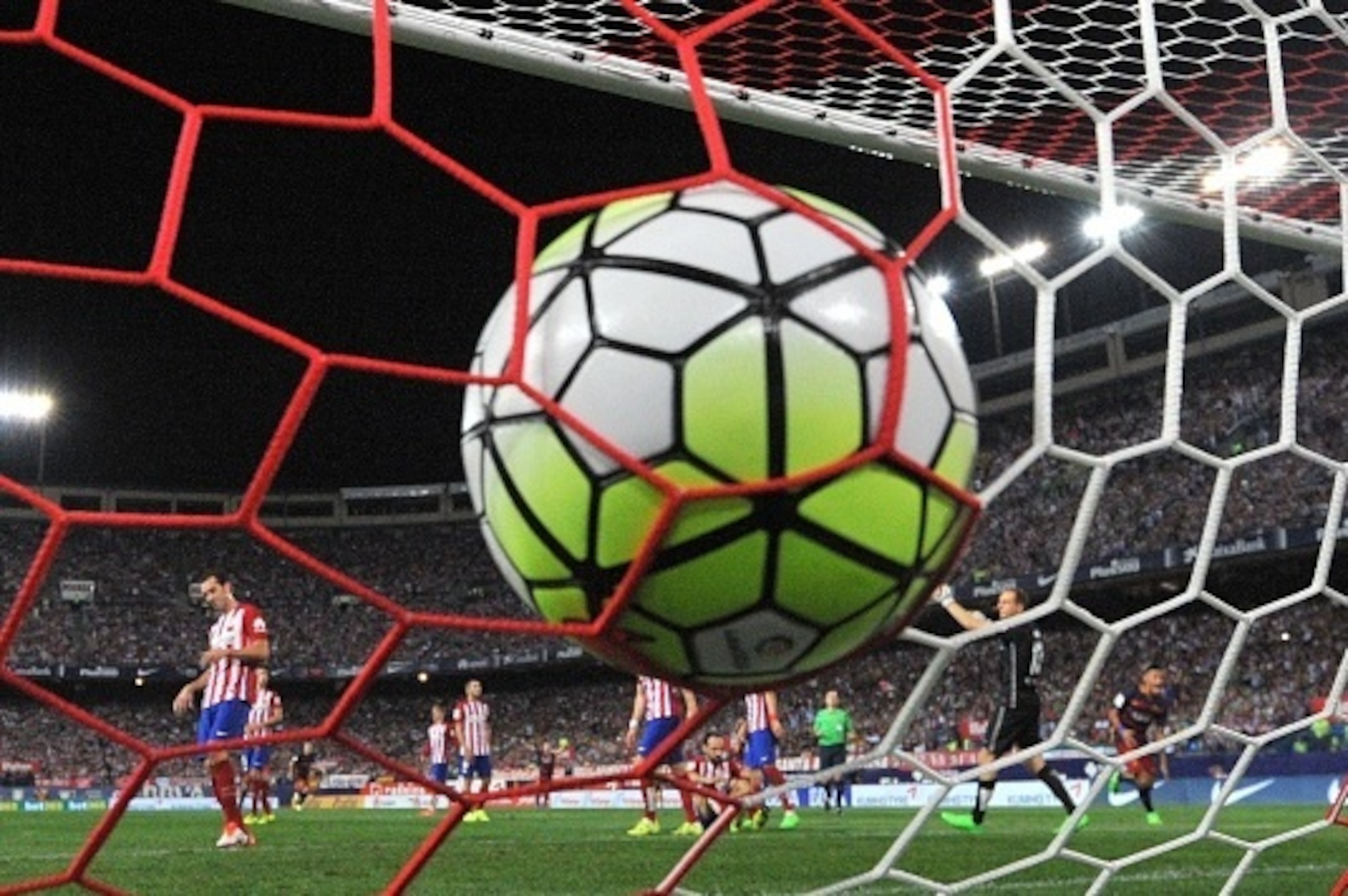 Barcelona's Argentinian forward Lionel Messi (unseen) scores during the Spanish league football match Club Atletico de Madrid vs FC Barcelona at the Vicente Calderon stadium in Madrid on September 12, 2015.   AFP PHOTO/ GERARD JULIEN        (Photo credit 