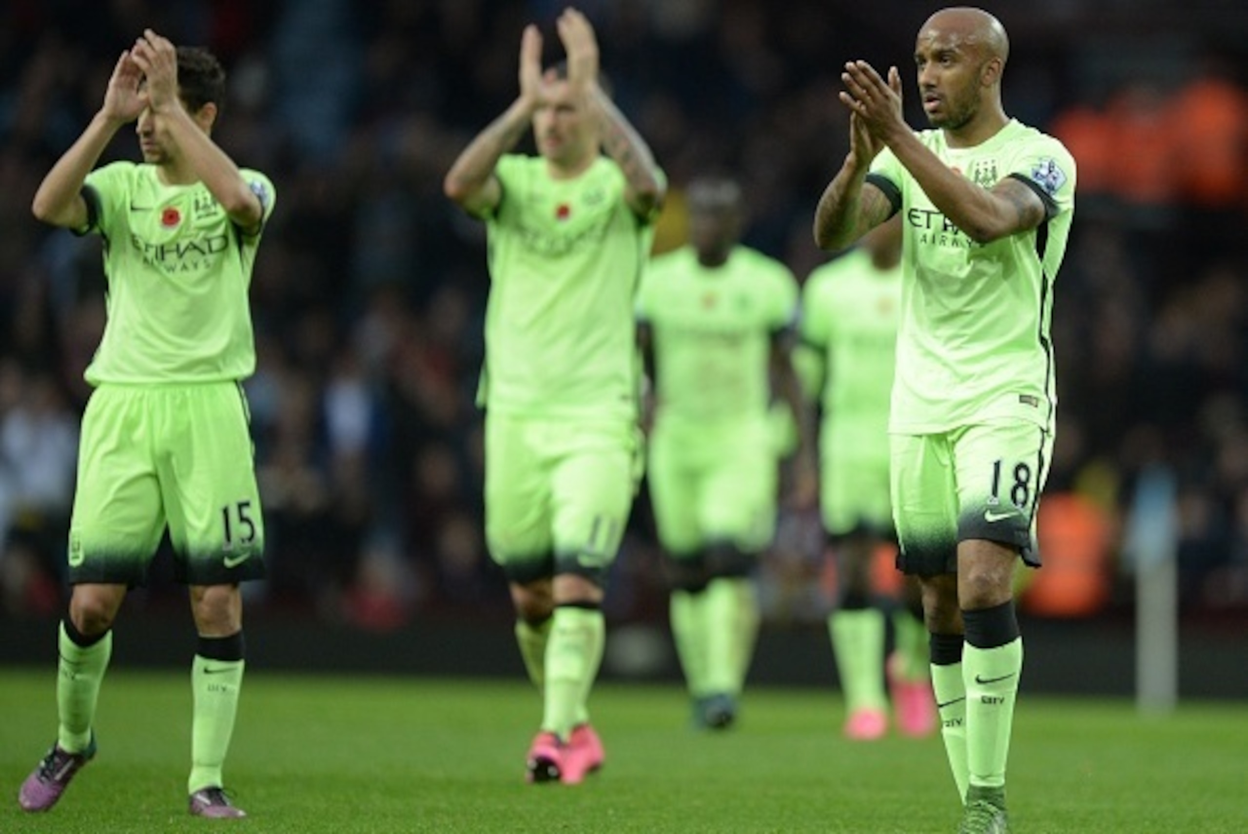Manchester City's English midfielder Fabian Delph (R) applauds fans after the English Premier League football match between Aston Villa and Manchester City at Villa Park in Birmingham, central England on November 8, 2015.     AFP PHOTO / OLI SCARFF

RESTR