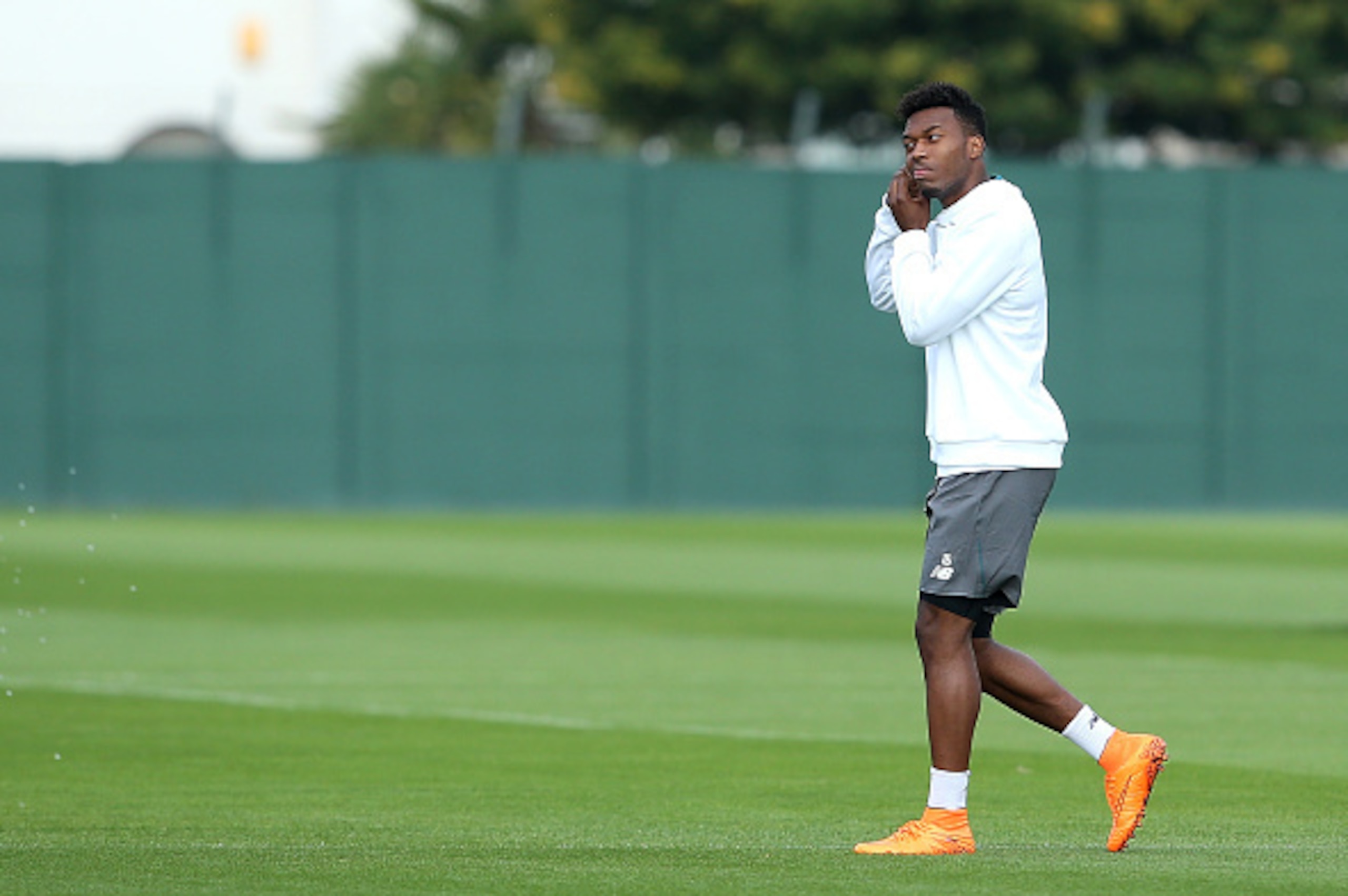 LIVERPOOL, ENGLAND - SEPTEMBER 30:  Daniel Sturridge removes jewelery from his ear during a Liverpool FC training session at Melwood Training Ground on September 30, 2015 in Liverpool, England.  (Photo by Jan Kruger/Getty Images)