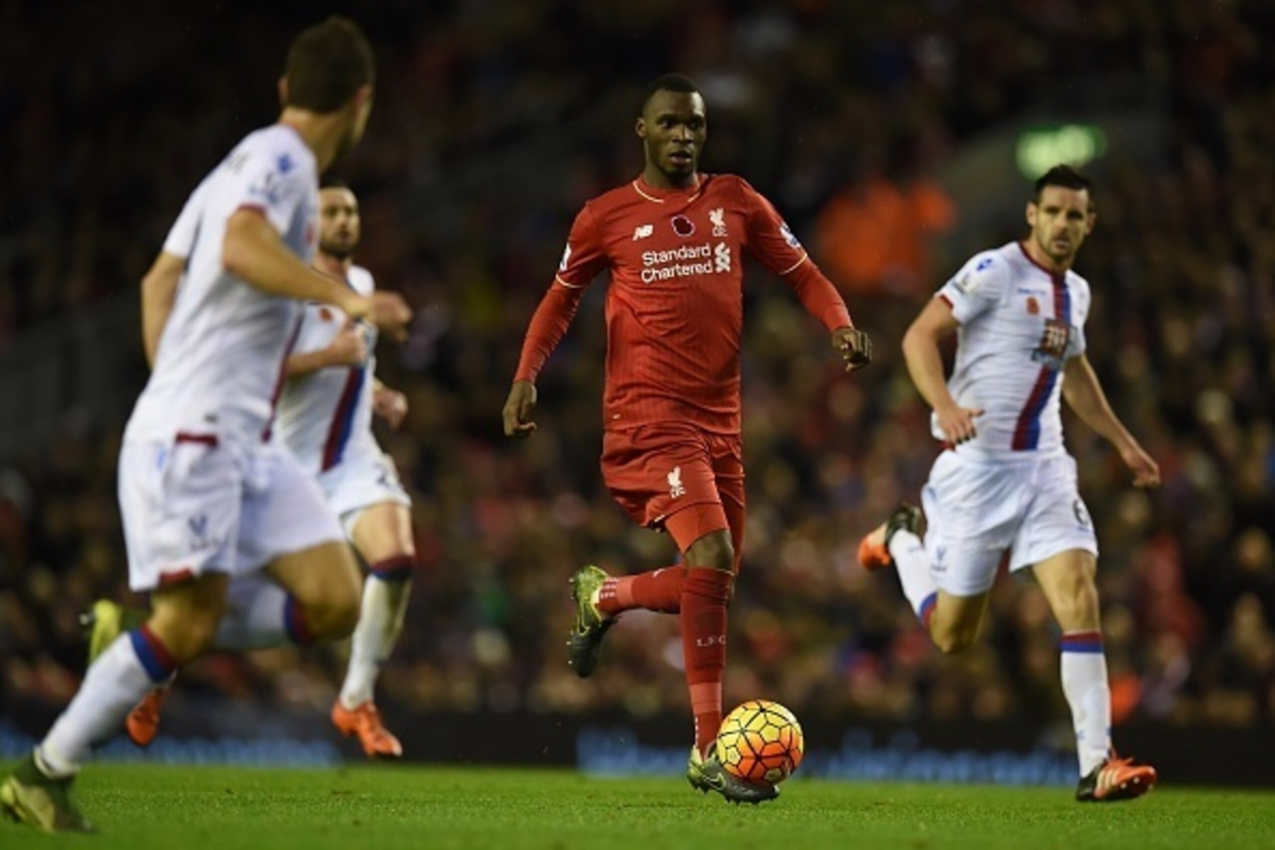 Liverpool's Zaire-born Belgian striker Christian Benteke (C) runs with the ball during the English Premier League football match between Liverpool and Crystal Palace at the Anfield stadium in Liverpool, north-west England on November 8, 2015.     AFP PHOT