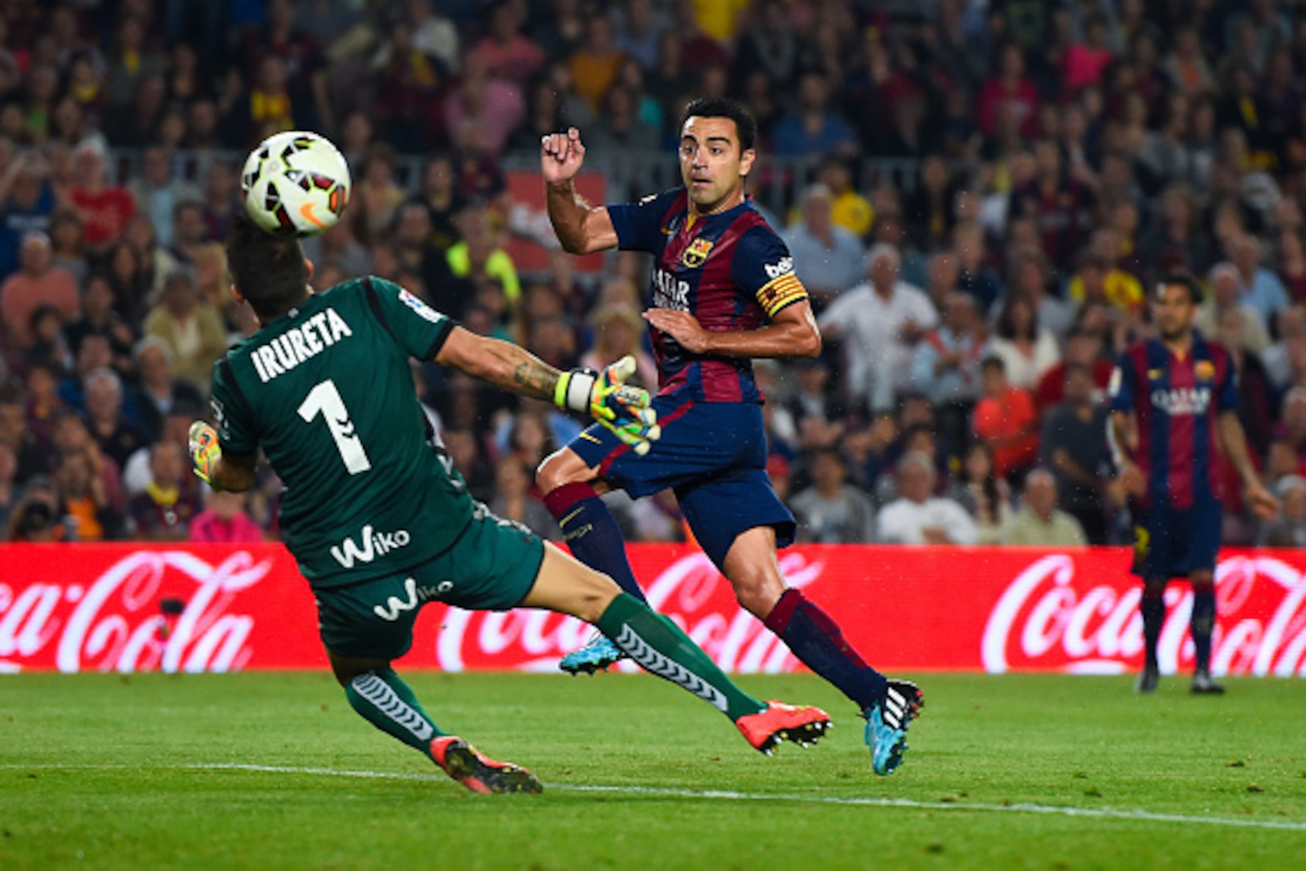 BARCELONA, SPAIN - OCTOBER 18: Xavi Hernandez of FC Barcelona scores the opening goal past Xabi Irureta of SD Eibar during the La Liga match between FC Barcelona and SD Eibar at Camp Nou on October 18, 2014 in Barcelona, Spain. (Photo by David Ramos/Get BARCELONA, SPAIN - OCTOBER 18: Xavi Hernandez of FC Barcelona scores the opening goal past Xabi Irureta of SD Eibar during the La Liga match between FC Barcelona and SD Eibar at Camp Nou on October 18, 2014 in Barcelona, Spain. (Photo by David Ramos/Get