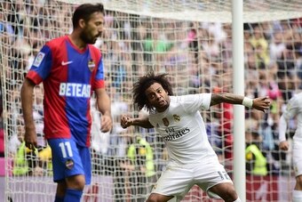 Real Madrid's Brazilian defender Marcelo celebrates a goal during the Spanish league football match Real Madrid CF vs Levante UD at the Santiago Bernabeu stadium in Madrid on October 17, 2015. AFP PHOTO/ PIERRE-PHILIPPE MARCOU        (Photo credit should 