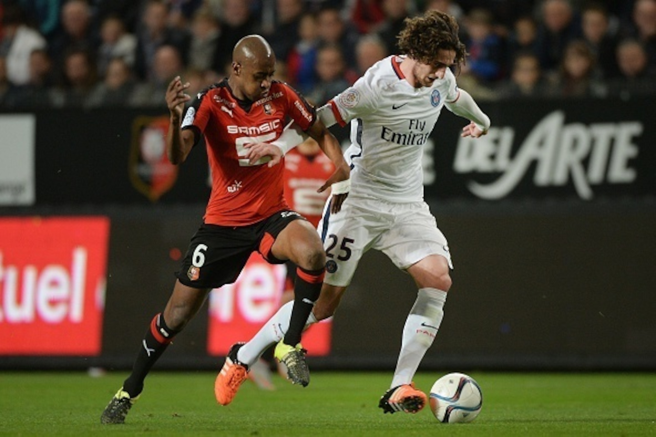 Rennes' Cape Verdean midfielder Gelson Fernandes (L) vies with Paris Saint-Germain's French midfielder Adrien Rabiot during the French L1 football match between Rennes and Paris Saint-Germain on October 30, 2015 at the Roazhon Park in Rennes, north-wester