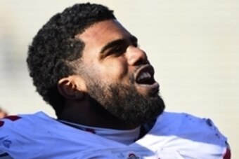 Nov 14, 2015; Champaign, IL, USA; Ohio State Buckeyes running back Ezekiel Elliott (15) sings toward the Ohio State fan section after the game at Memorial Stadium. Ohio State defats Illinois 28-3. Mandatory Credit: Mike DiNovo-USA TODAY Sports