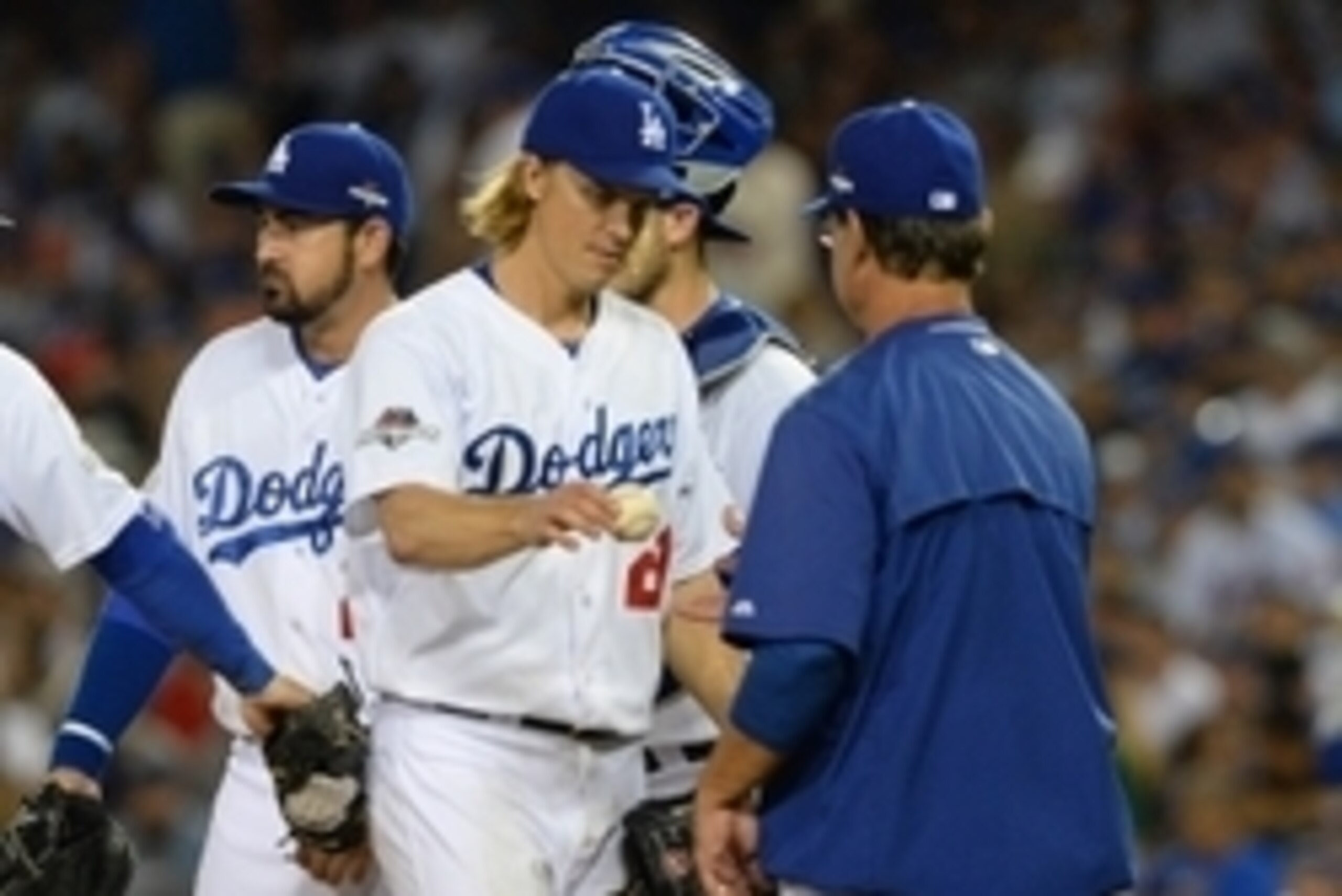 October 15, 2015; Los Angeles, CA, USA; Los Angeles Dodgers starting pitcher Zack Greinke (21) is relieved in the seventh inning by manager Don Mattingly (8) against New York Mets in game five of NLDS at Dodger Stadium. Mandatory Credit: Jayne Kamin-Oncea